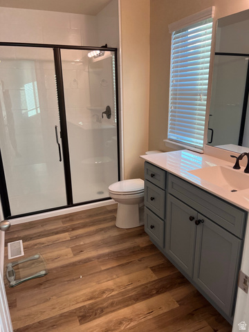 2001 Fielding Hill Lane Draper, UT 84020 - Photo 13 of 21 Full bathroom with vanity, a shower stall, and dark wood-style flooring