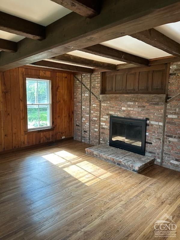 124 Plattekill Road Greenville, NY 12083 - Photo 4 of 14 an empty room with wooden floor fireplace and windows