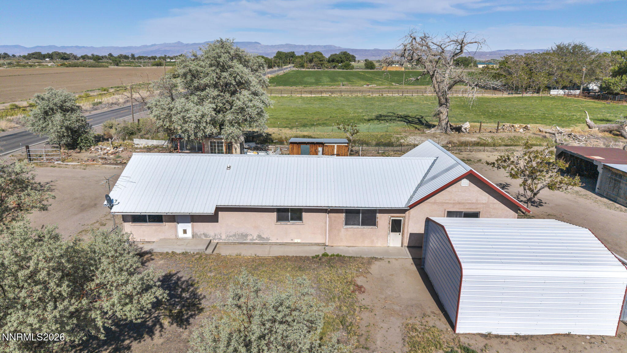 5250 Stillwater Road Fallon, NV 89406 - Photo 6 of 53 a aerial view of a house with a yard and lake view