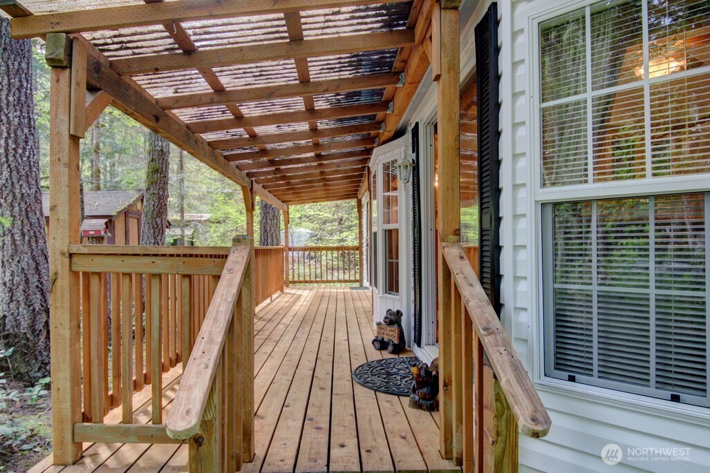 134 Drial Loop Maple Falls, WA 98266 - Photo 19 of 36 a view of balcony with wooden floor and outdoor space