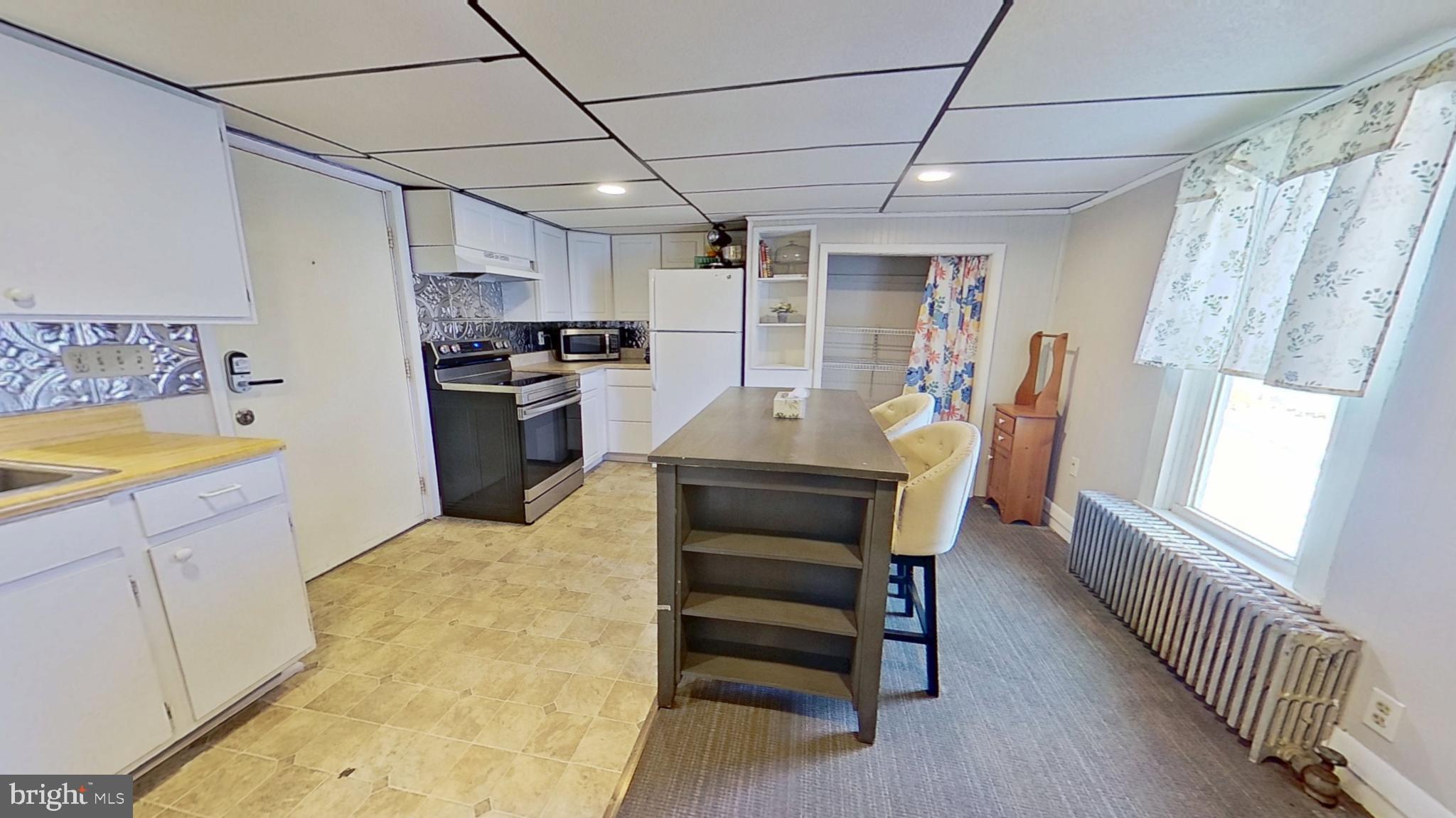 181 Cemetery Street Littlestown, PA 17340 - Photo 2 of 10 a kitchen with refrigerator and window