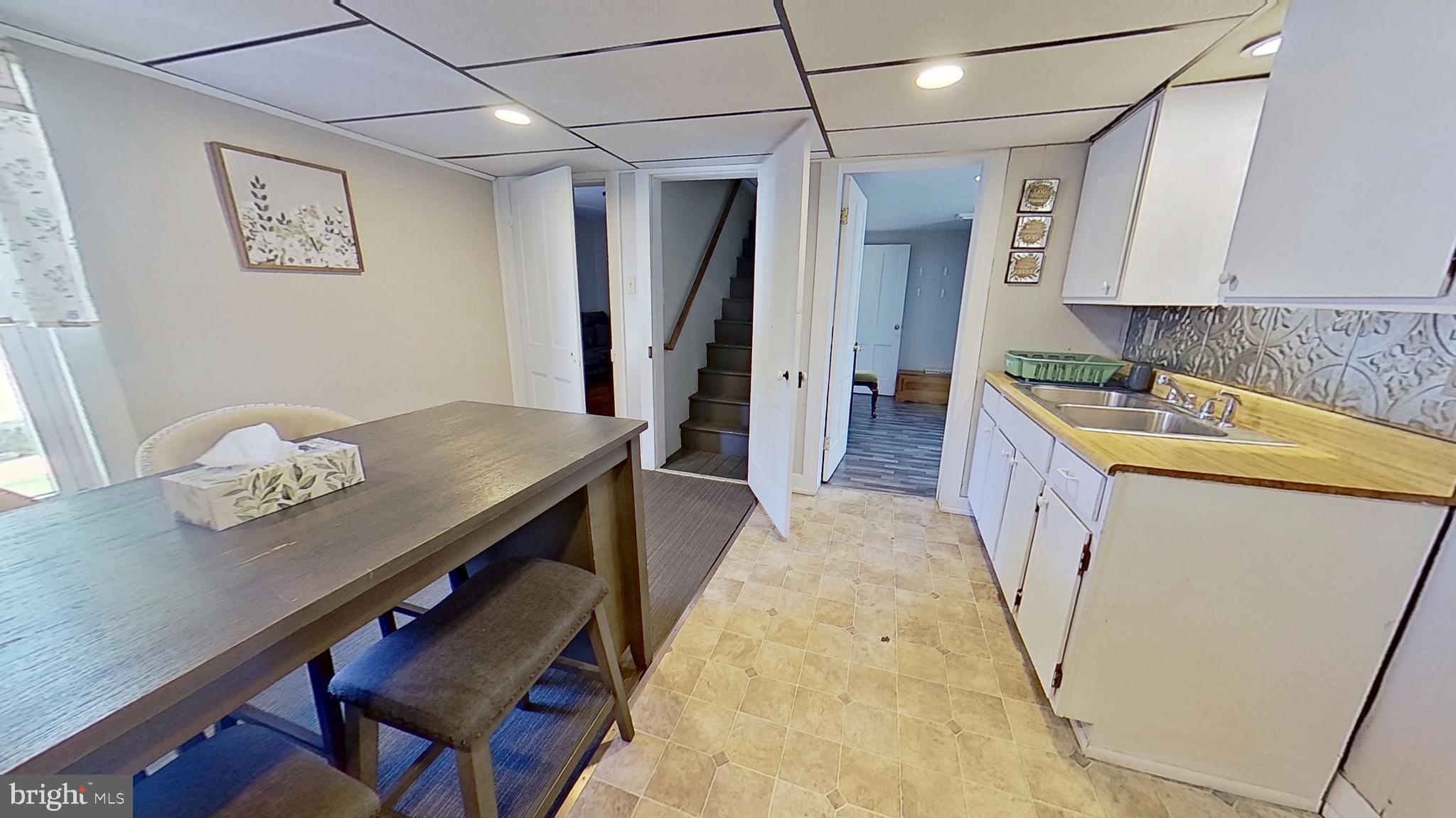 181 Cemetery Street Littlestown, PA 17340 - Photo 3 of 10 a kitchen with stainless steel appliances granite countertop a sink refrigerator and cabinets