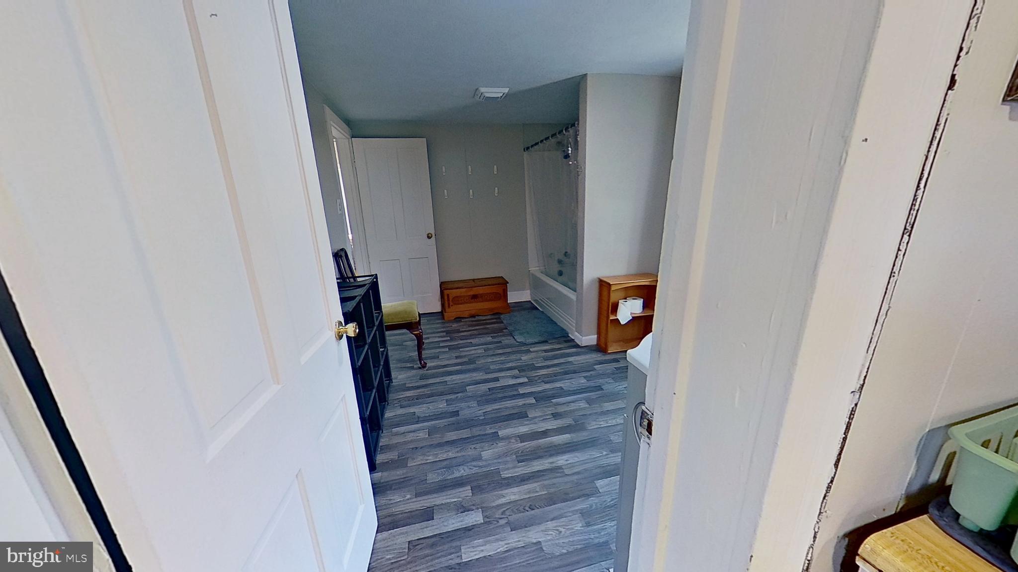 181 Cemetery Street Littlestown, PA 17340 - Photo 4 of 10 a view of a hallway with wooden floor and stairs