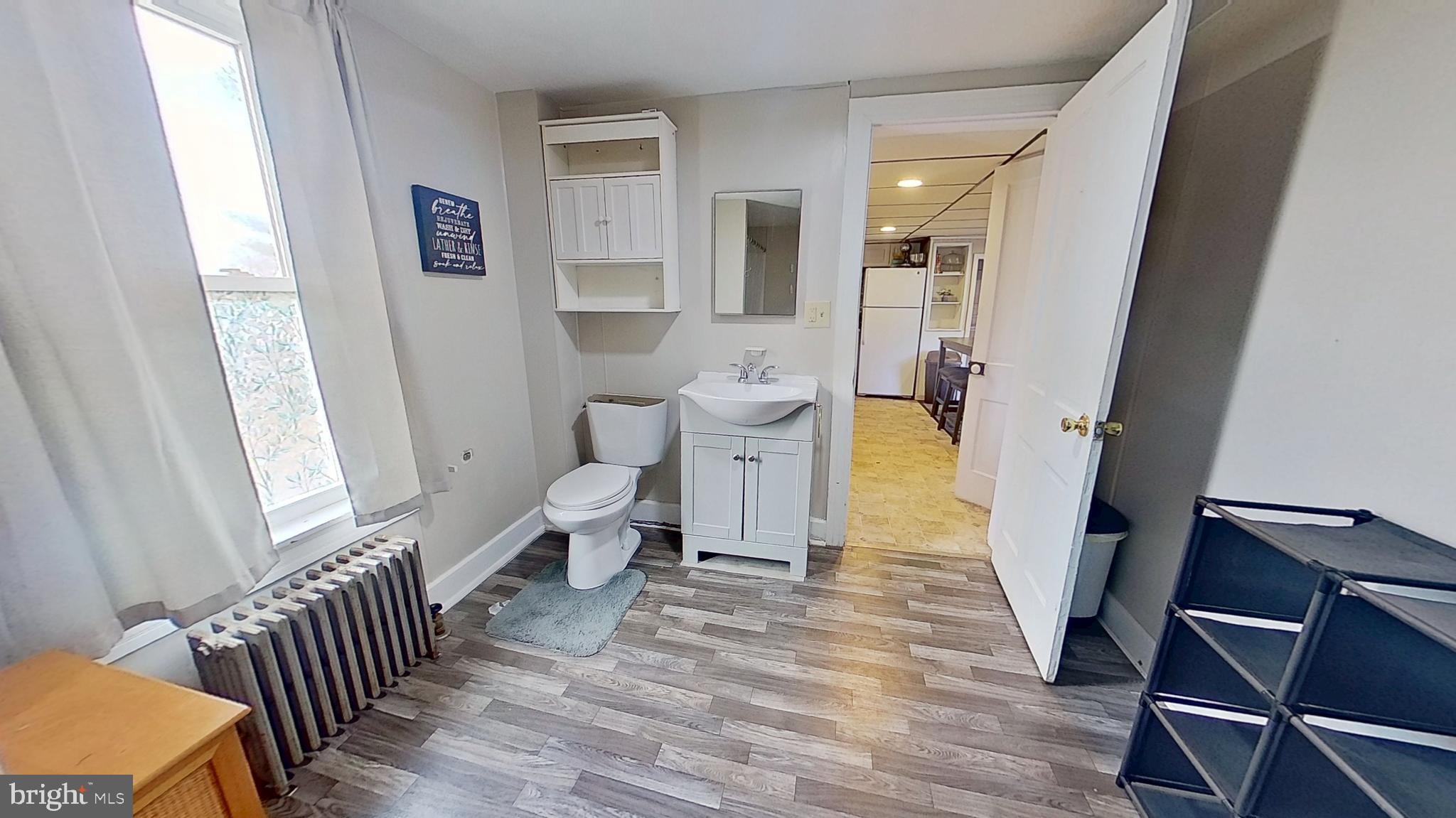 181 Cemetery Street Littlestown, PA 17340 - Photo 5 of 10 a living room with furniture and a wooden floor