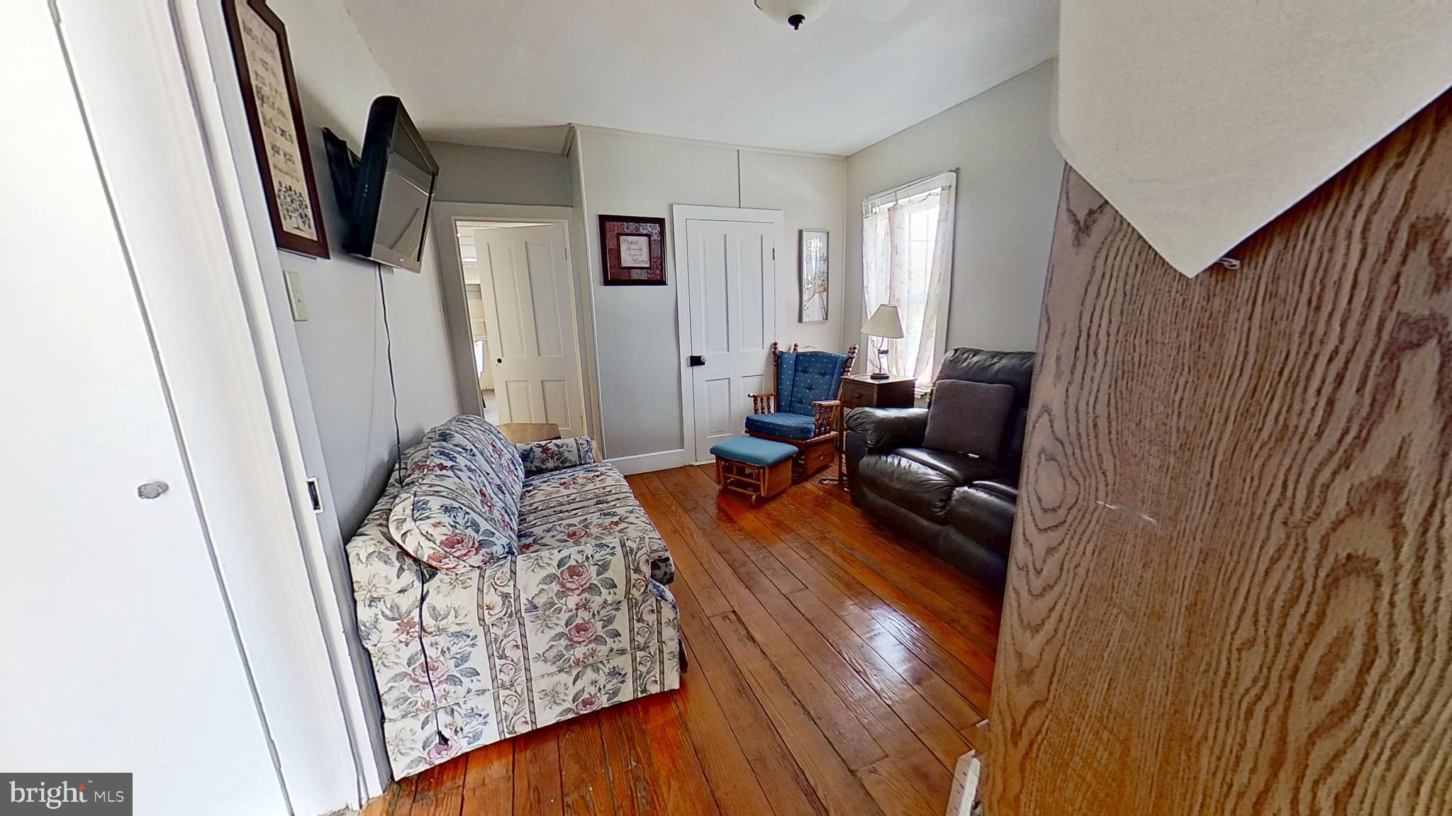 181 Cemetery Street Littlestown, PA 17340 - Photo 6 of 10 a living room with furniture and a flat screen tv