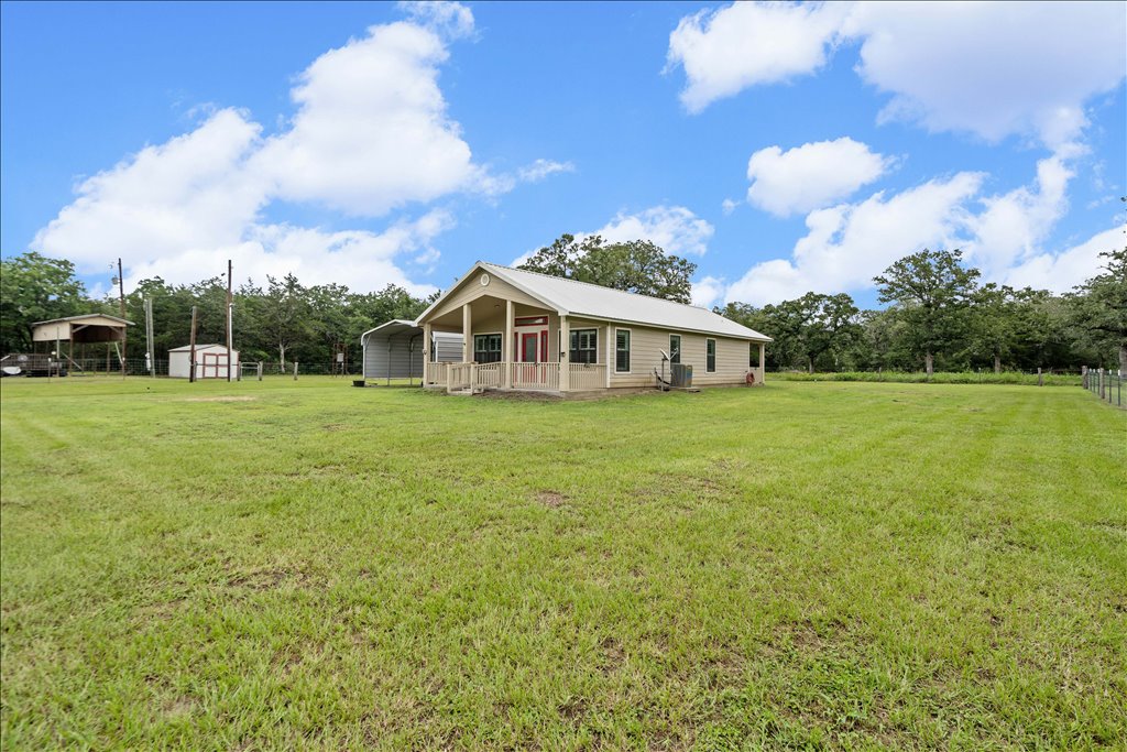 608 Whistleville Road Flatonia, TX 78941 - Photo 2 of 26 You have so much open acreage and breathing room out here.