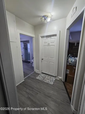 a view of livingroom with hardwood floor and a sink