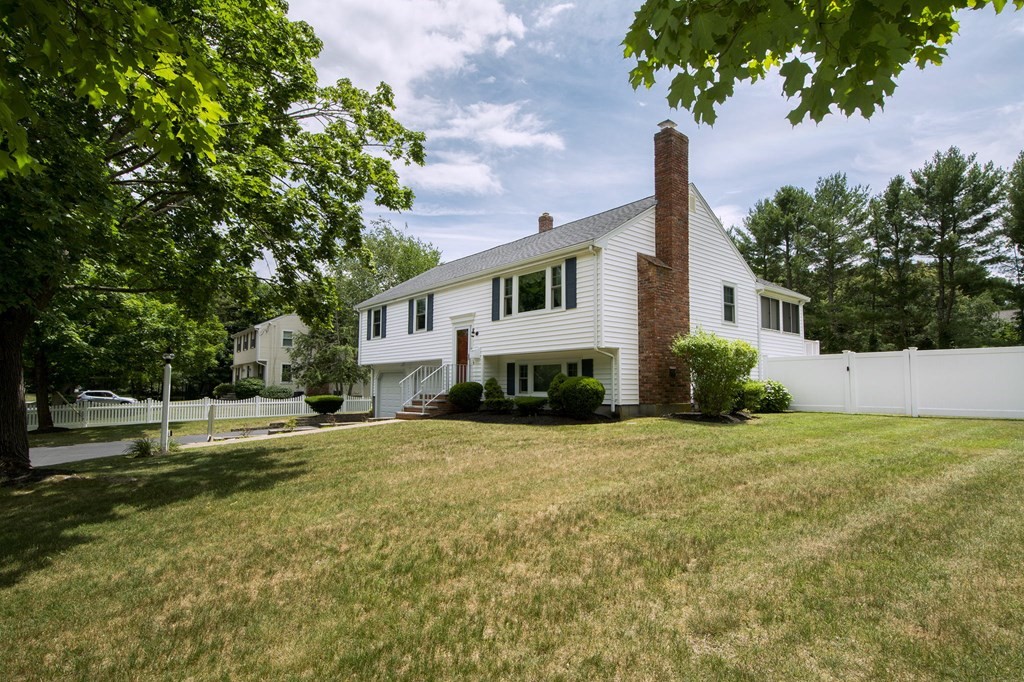 9 Heritage Road Hingham, MA 02043 - Photo 2 of 11 a house that has a tree in front of it