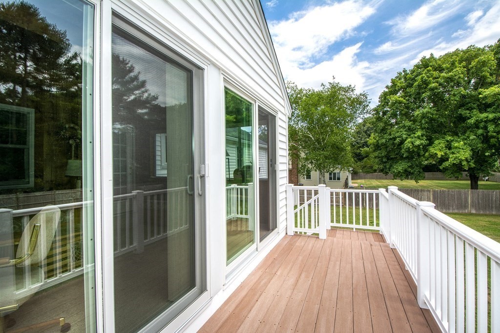 9 Heritage Road Hingham, MA 02043 - Photo 4 of 11 a view of balcony with two chairs and wooden fence
