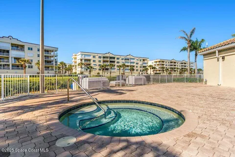 a view of a swimming pool with a lounge chairs