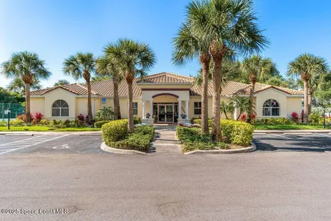 a front view of a house with garden and entryway