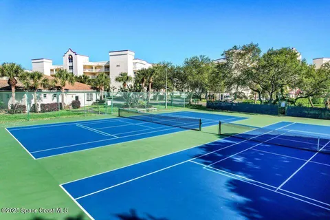 a view of an outdoor space and tennis court