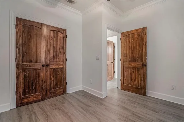 an entryway with wooden floor