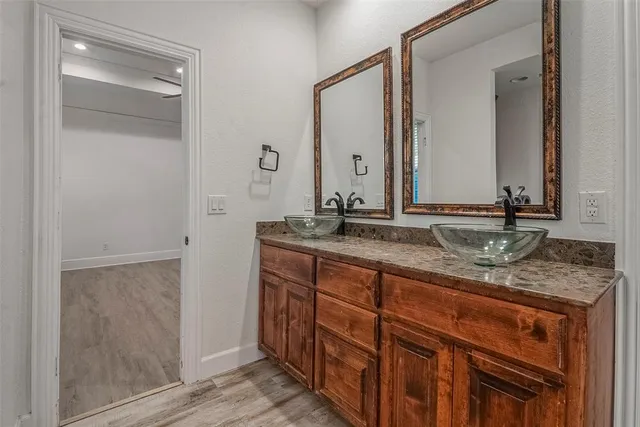 a white bath tub sitting next to a shower