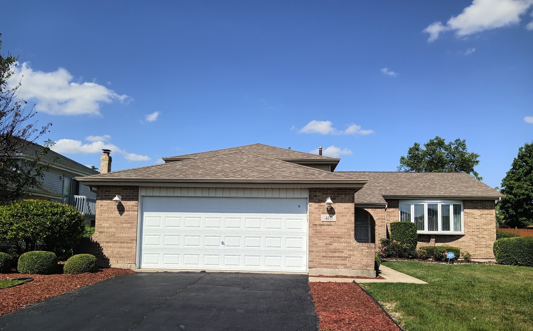 410 Highland Road Matteson, IL 60443 - Photo 1 of 27 a front view of a house with a yard