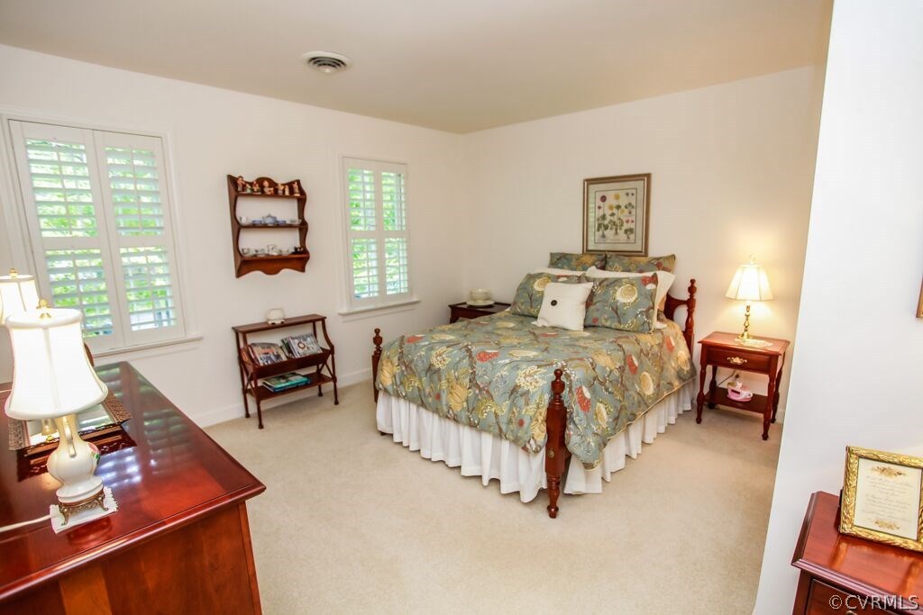 2321 Corner Rock Road Midlothian, VA 23113 - Photo 15 of 25 a bedroom with a bed couch and a window