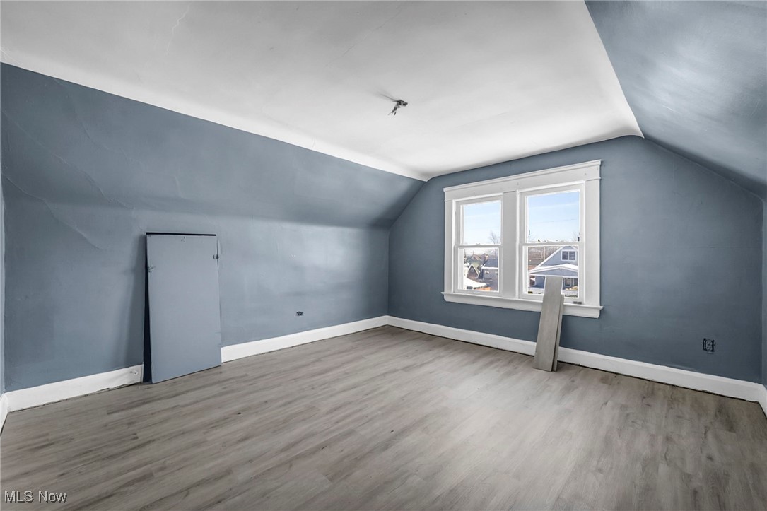 1854 Grantham Road Cleveland, OH 44112 - Photo 25 of 47 Additional living space featuring baseboards and wood finished floors