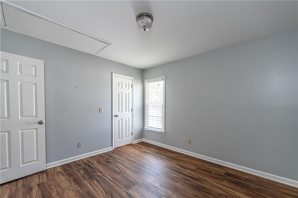113 Warwick Way Rome, GA 30161 - Photo 36 of 49 a view of an empty room with wooden floor and a window