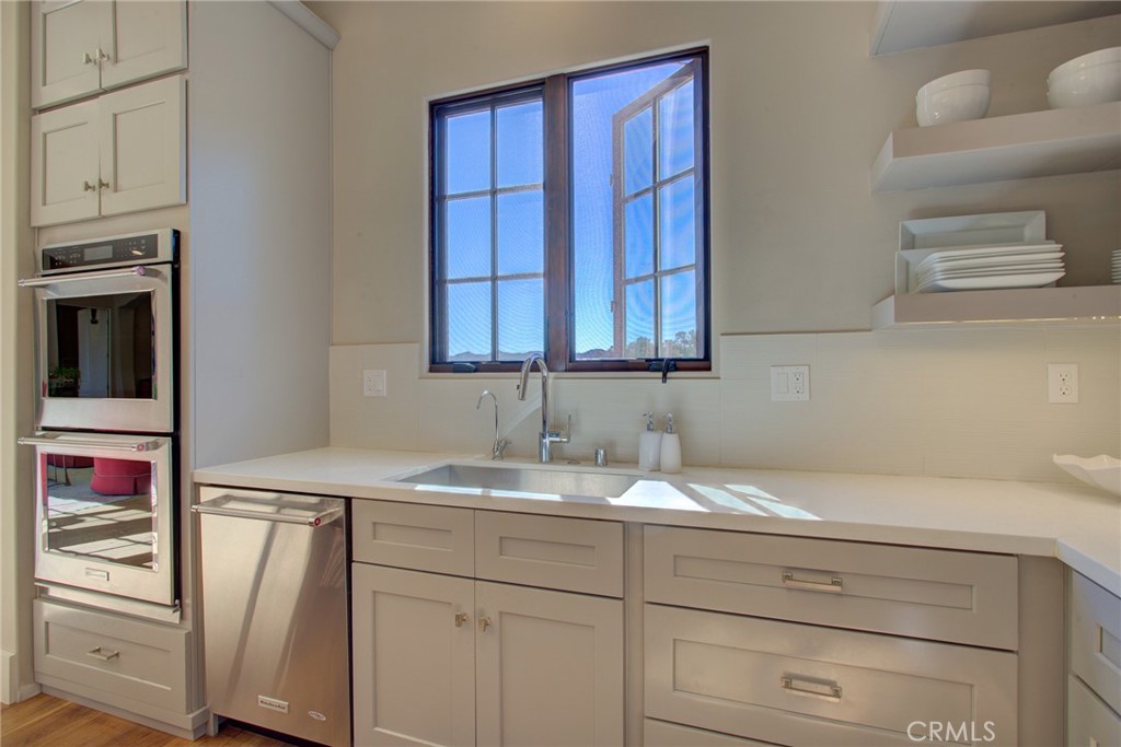 250 Mission Springs Road Arroyo Grande, CA 93420 - Photo 13 of 73 a bathroom with a sink and a cabinets