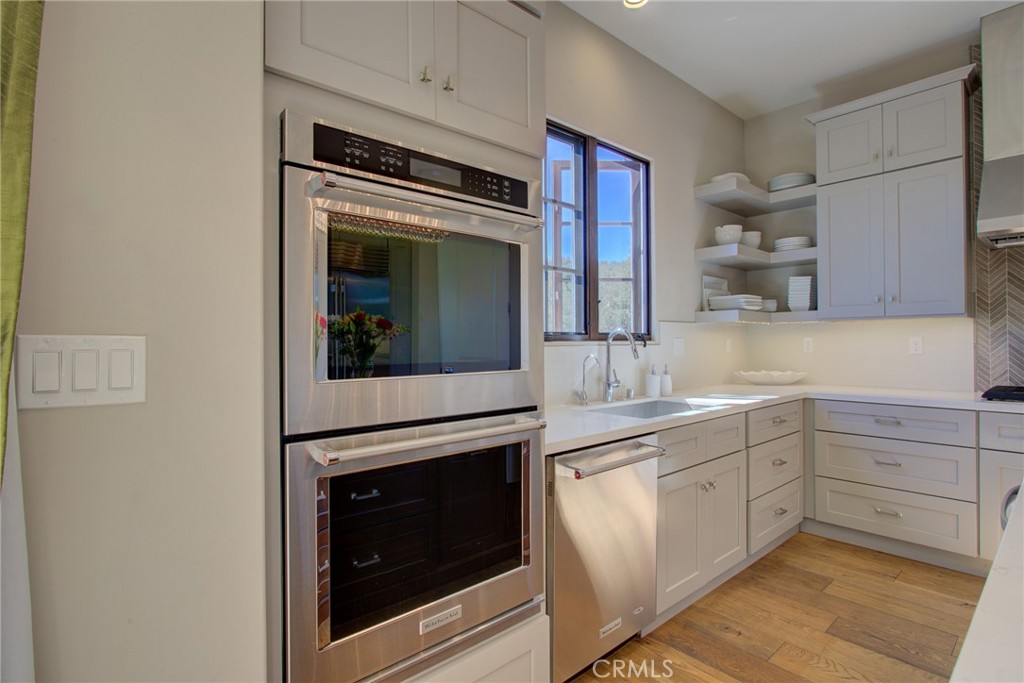 250 Mission Springs Road Arroyo Grande, CA 93420 - Photo 14 of 73 a kitchen with cabinets stainless steel appliances and a sink