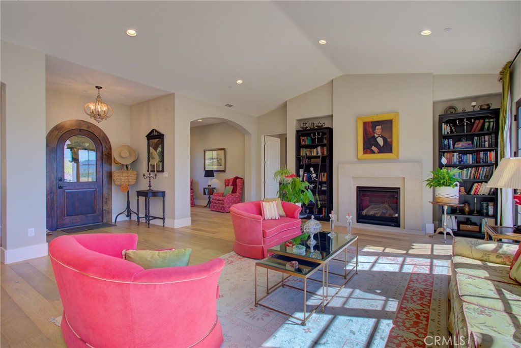 250 Mission Springs Road Arroyo Grande, CA 93420 - Photo 21 of 73 a living room with furniture a fireplace and bookshelf