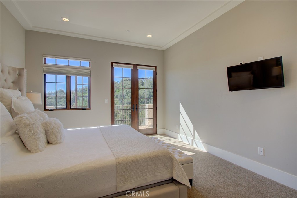 250 Mission Springs Road Arroyo Grande, CA 93420 - Photo 26 of 73 a bedroom with a large bed and a flat screen tv