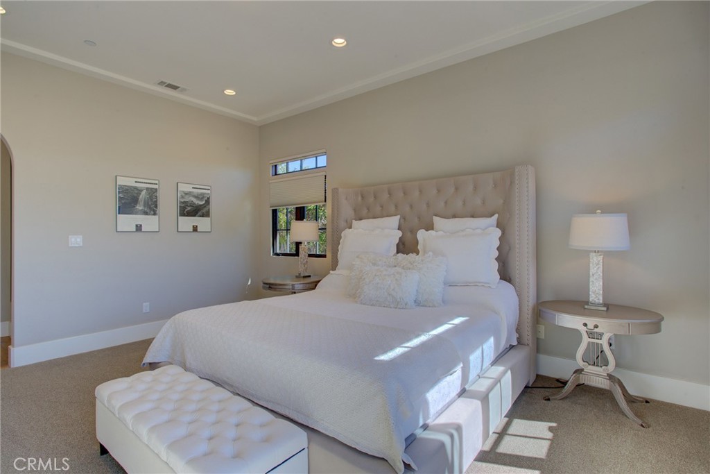 250 Mission Springs Road Arroyo Grande, CA 93420 - Photo 30 of 73 a bedroom with a bed and a lamp