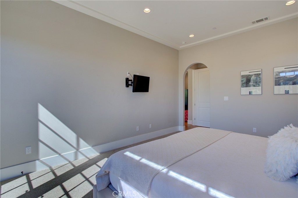 250 Mission Springs Road Arroyo Grande, CA 93420 - Photo 31 of 73 a bedroom with a bed and a flat screen tv
