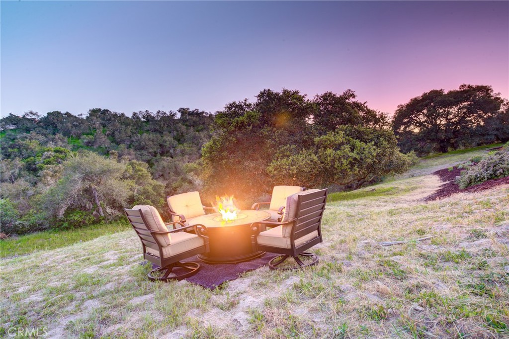 250 Mission Springs Road Arroyo Grande, CA 93420 - Photo 45 of 73 a backyard of a house with table and chairs