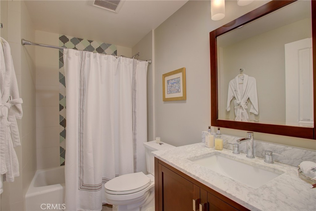 250 Mission Springs Road Arroyo Grande, CA 93420 - Photo 55 of 73 a bathroom with a granite countertop sink toilet and shower
