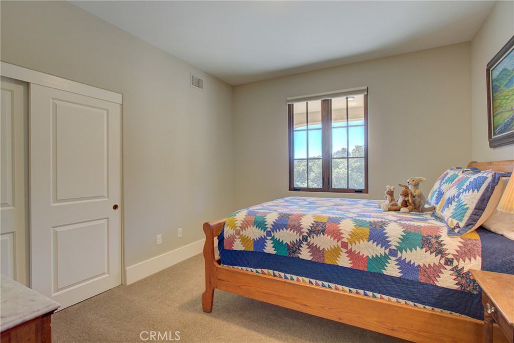 250 Mission Springs Road Arroyo Grande, CA 93420 - Photo 57 of 73 a bed sitting in a bedroom next to a window