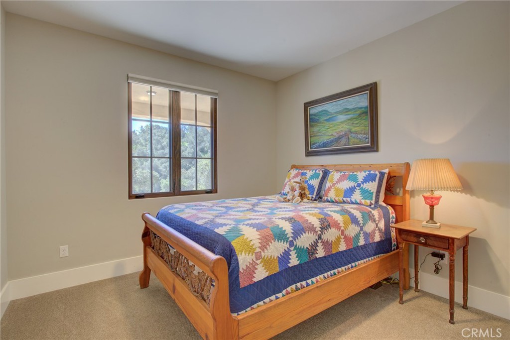 250 Mission Springs Road Arroyo Grande, CA 93420 - Photo 58 of 73 a bed sitting in a bedroom next to a window