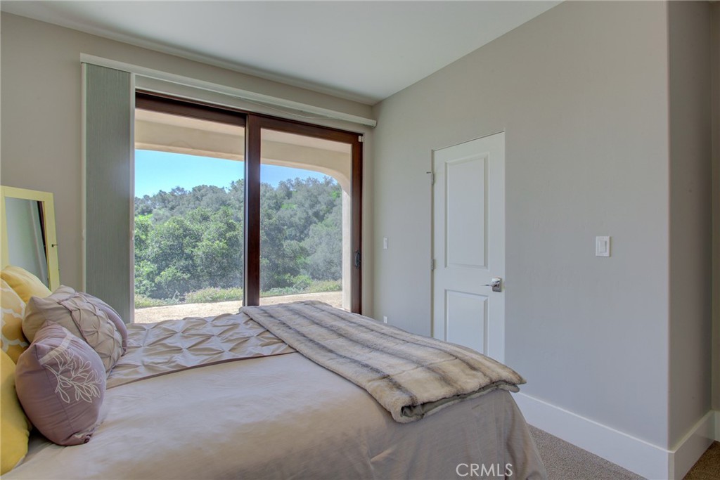 250 Mission Springs Road Arroyo Grande, CA 93420 - Photo 61 of 73 a bedroom with a bed and a large window