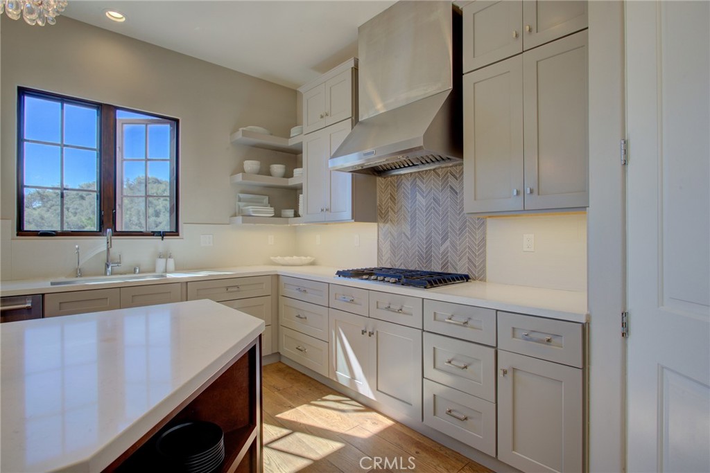 250 Mission Springs Road Arroyo Grande, CA 93420 - Photo 10 of 73 a kitchen with white cabinets and sink