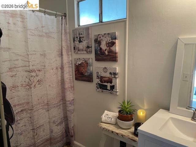 16629 Allison Way, Unit 22 Sonora, CA 95370 - Photo 17 of 30 Bathroom with a shower with shower curtain and vanity