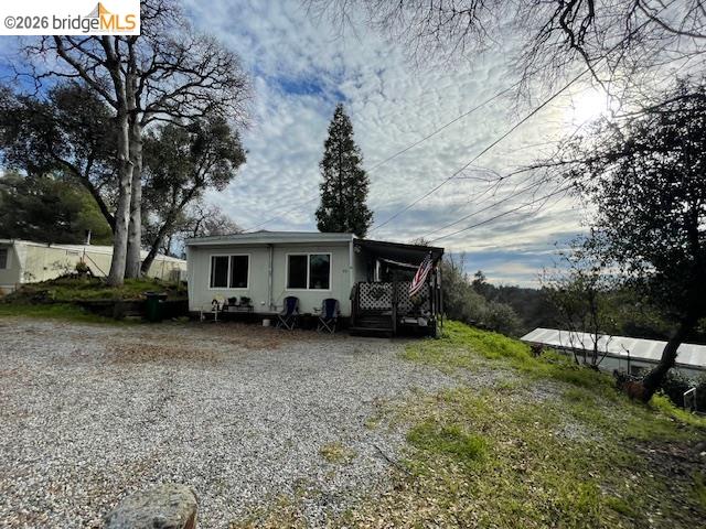 16629 Allison Way, Unit 22 Sonora, CA 95370 - Photo 30 of 30 View of front facade with a wooden deck