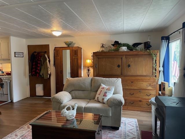 16629 Allison Way, Unit 22 Sonora, CA 95370 - Photo 5 of 31 Living area with wood finished floors and a wood stove