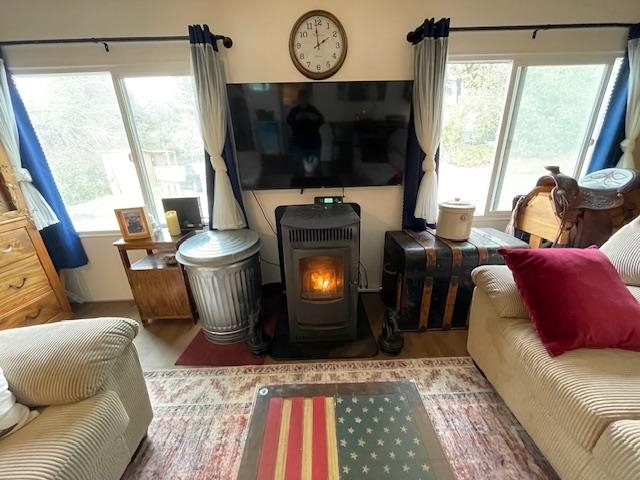 16629 Allison Way, Unit 22 Sonora, CA 95370 - Photo 7 of 31 Living area with a wood stove and wood finished floors
