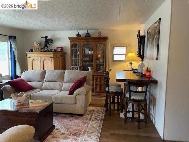 16629 Allison Way, Unit 22 Sonora, CA 95370 - Photo 9 of 30 a living room with furniture a flat screen tv and a table