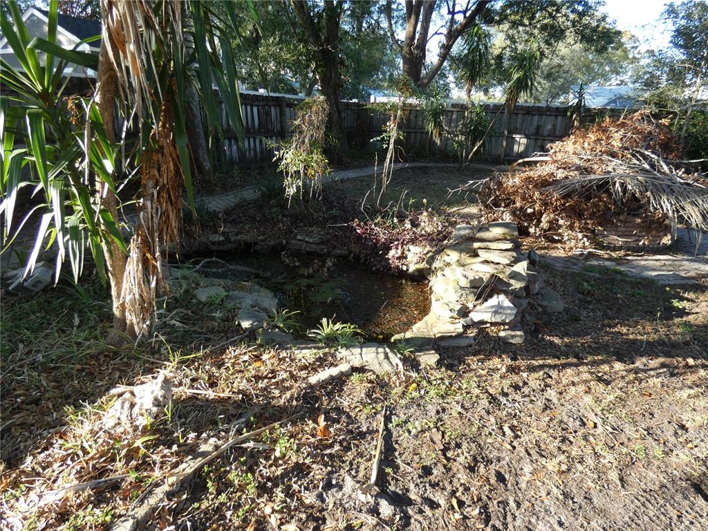 8526 Delaware Drive Weeki Wachee, FL 34607 - Photo 4 of 5 a backyard of a house with lots of green space