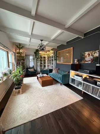 a view of a living room and dining room