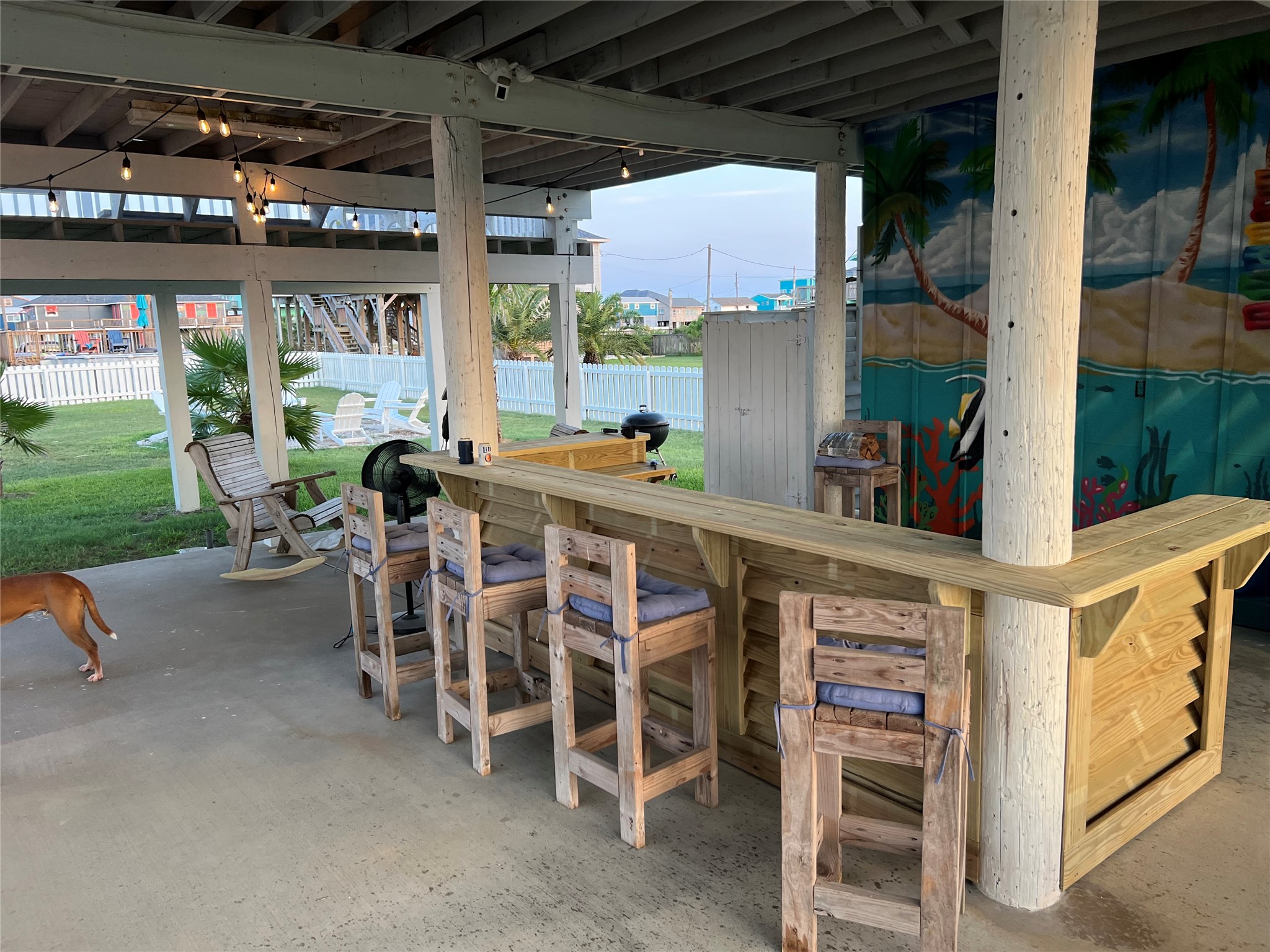 307 Angel Wing Street Surfside Beach, TX 77541 - Photo 20 of 23 Whether you grilling, having a drink at the bar or hanging around the firepit, this is the ultimate space to relax and make unforgettable memories!