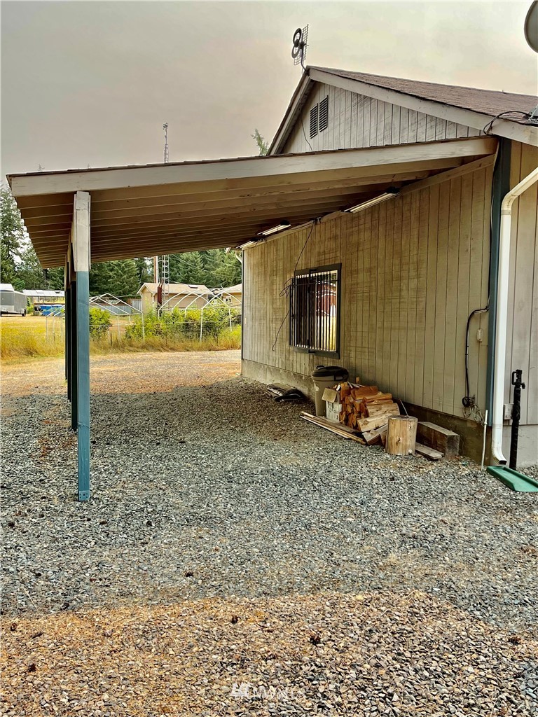 19225 Patterson Road East Orting, WA 98360 - Photo 11 of 34 a view of a room with a wooden floor and a floor to ceiling window