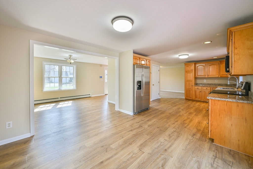 99 Smith Road Charlton, MA 01507 - Photo 15 of 37 a view of a kitchen with a sink and a stove