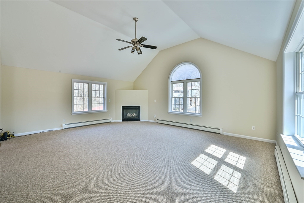 99 Smith Road Charlton, MA 01507 - Photo 21 of 37 an empty room with windows and fireplace