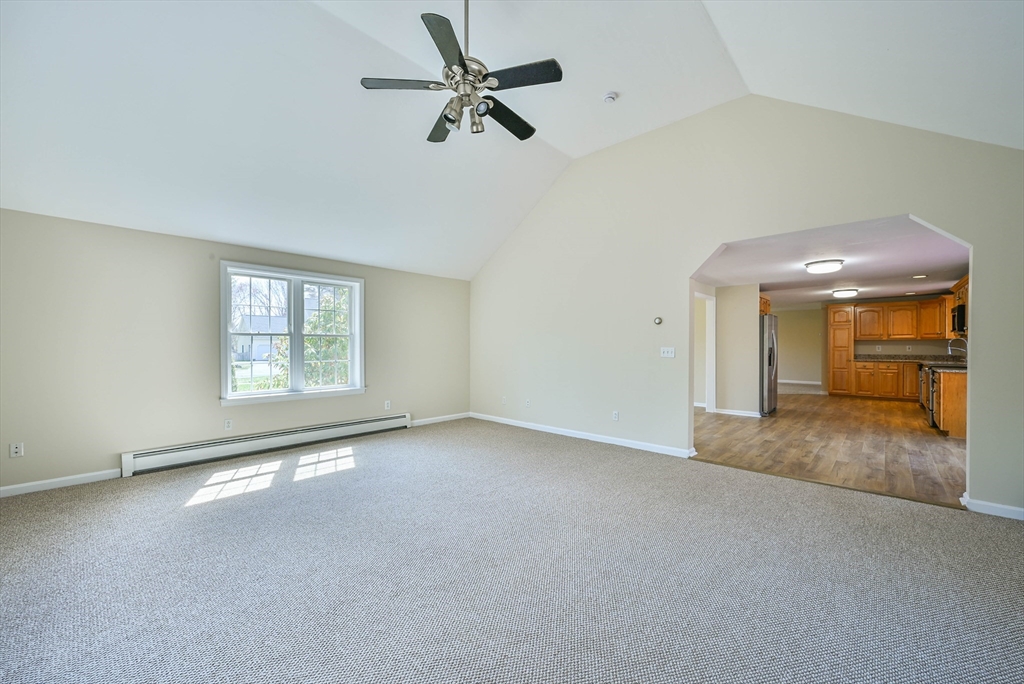 99 Smith Road Charlton, MA 01507 - Photo 23 of 37 a view of a livingroom with a ceiling fan and window