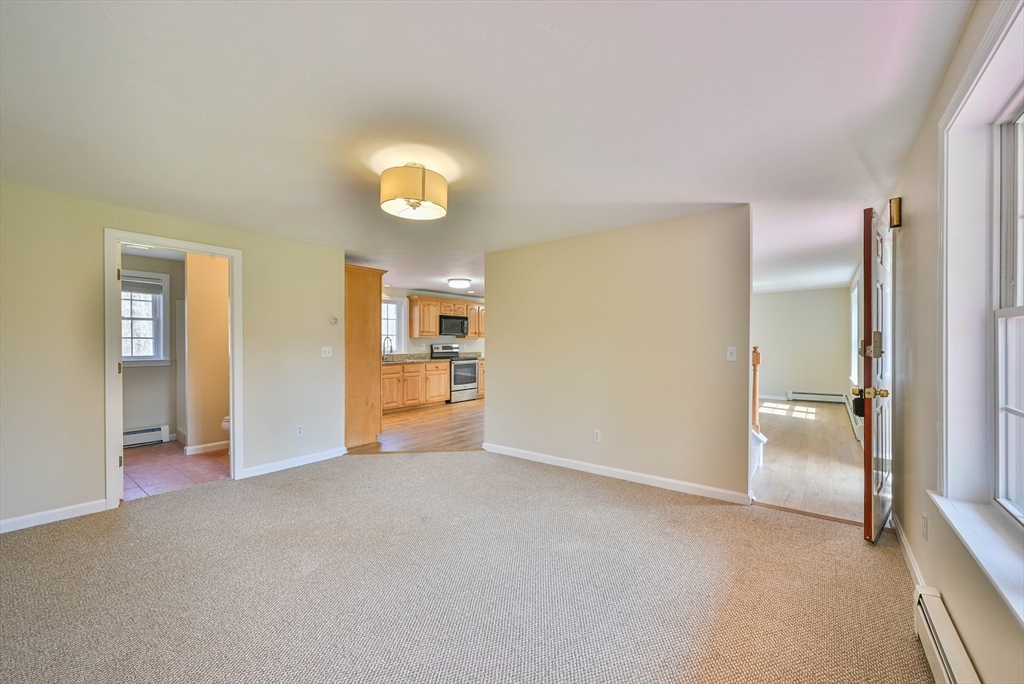 99 Smith Road Charlton, MA 01507 - Photo 26 of 37 an empty room with windows and entrance