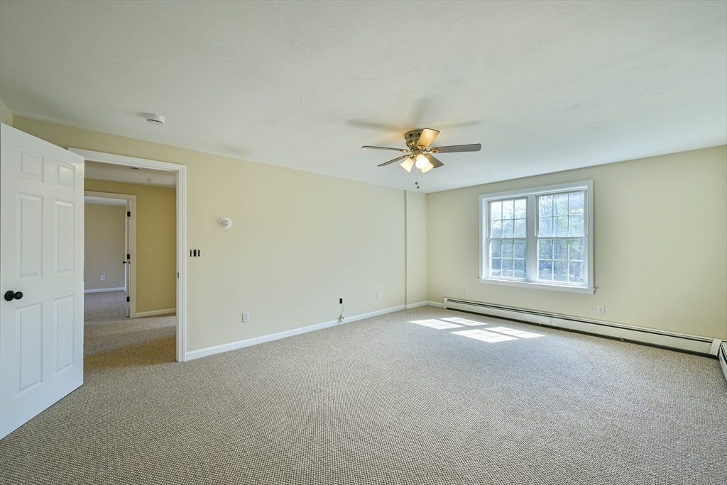 99 Smith Road Charlton, MA 01507 - Photo 29 of 37 a view of an empty room with a window