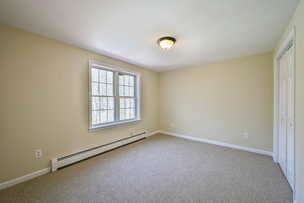 99 Smith Road Charlton, MA 01507 - Photo 33 of 37 an empty room with a window