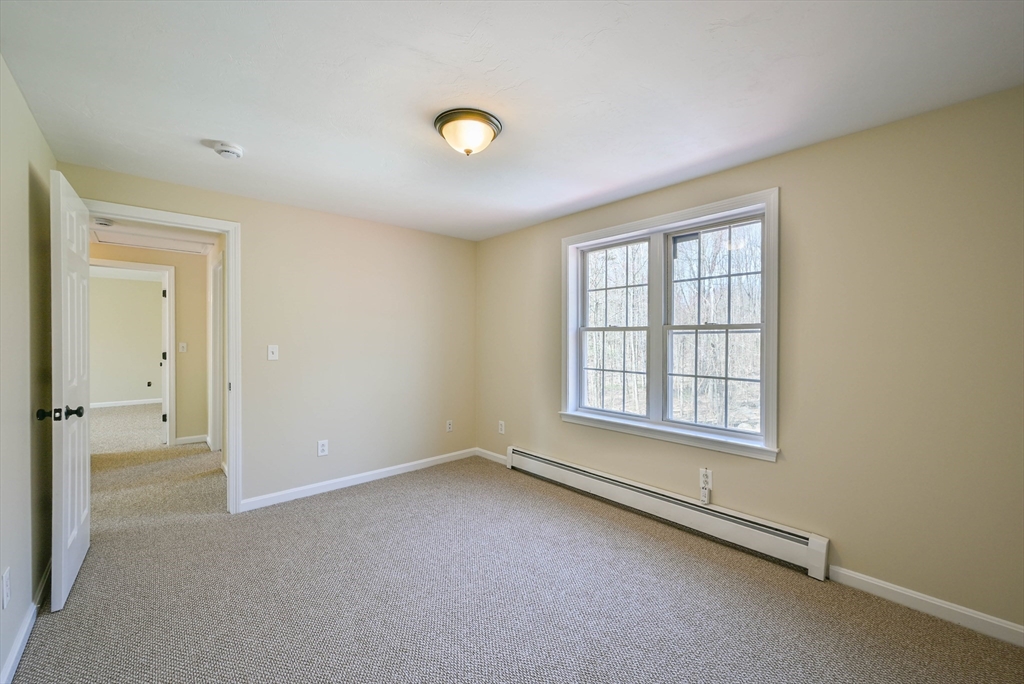 99 Smith Road Charlton, MA 01507 - Photo 34 of 37 an empty room with windows